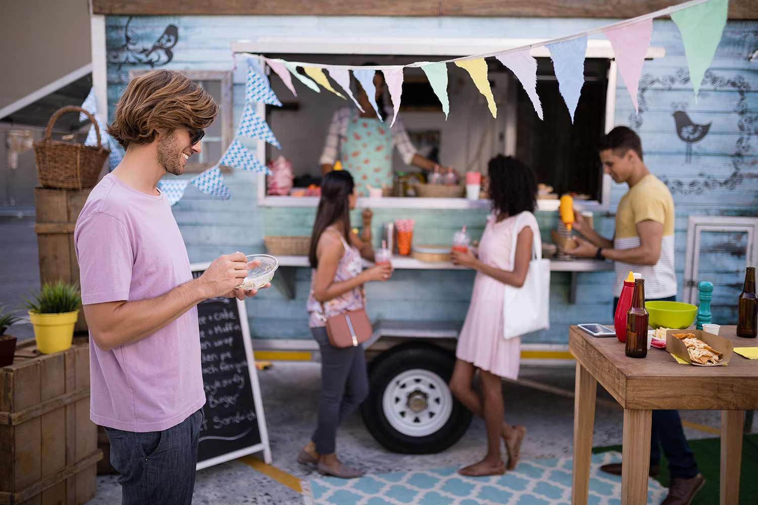 customers-having-snacks-from-food-truck-EDLBVPX.jpg